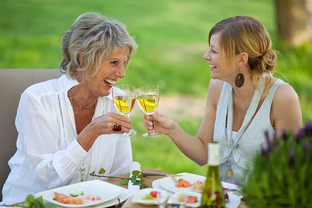 botox-juvederm-patients-sipping-wine-together