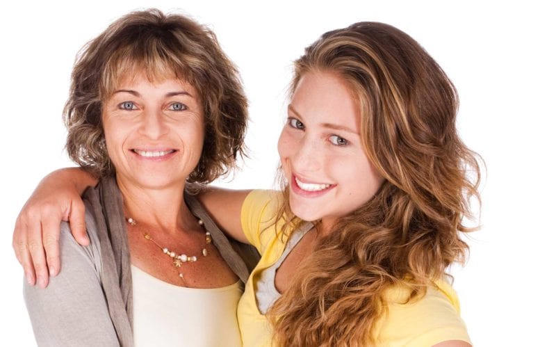 Mom and daughter smiling